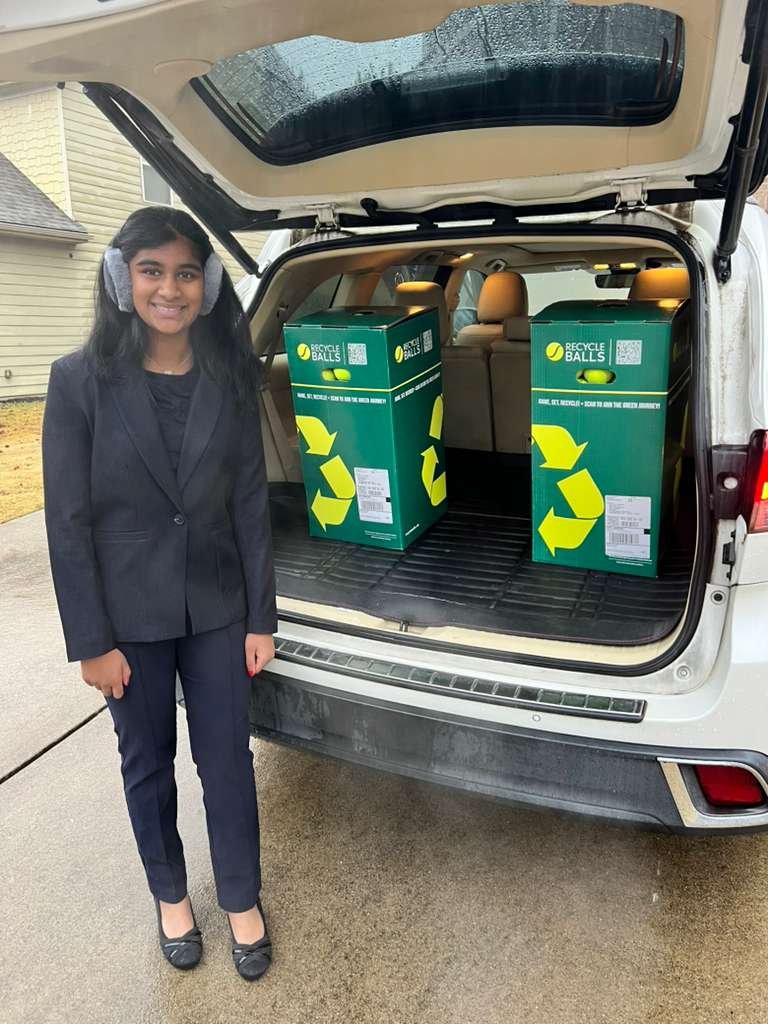 Founder Arjit with recycling boxes ready for collection